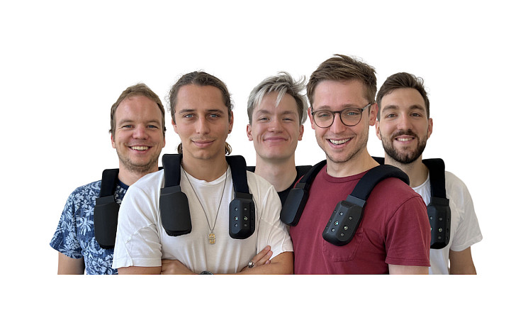 The biped.ai team works on a smart harness, worn on shoulders, that uses self-driving technology to guide people with short sounds.